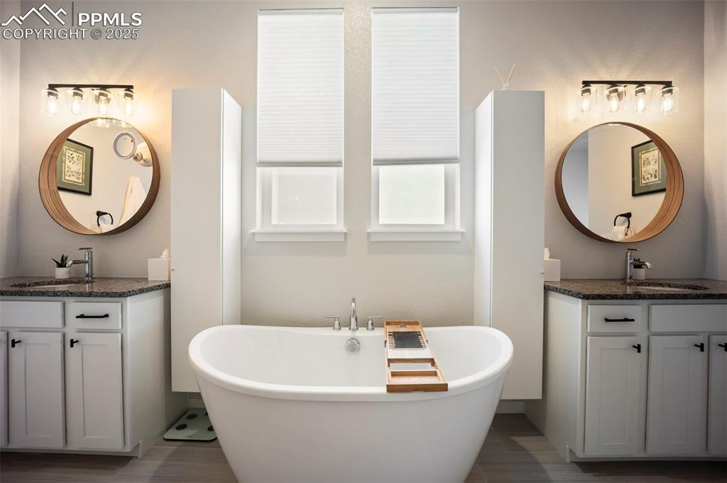 Image 26 of 50: Primary Bath with double vanities and soaking tub