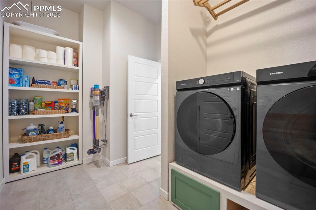 Image 30 of 50: Laundry room with Samsung washer/dryer