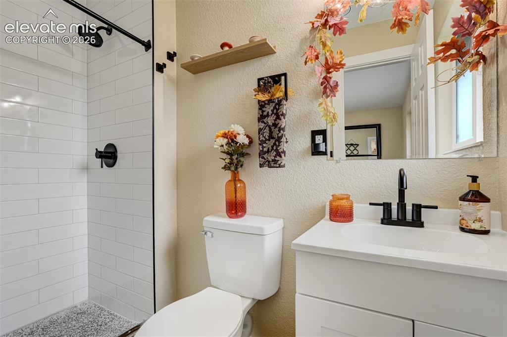 Image 22 of 50: Connected bath with beautiful walk-in shower.