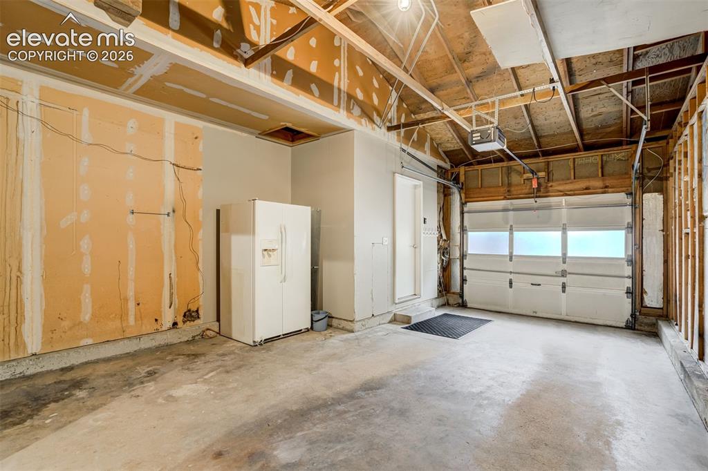 Image 43 of 50: Oversized one car garage located on the front of the house.
