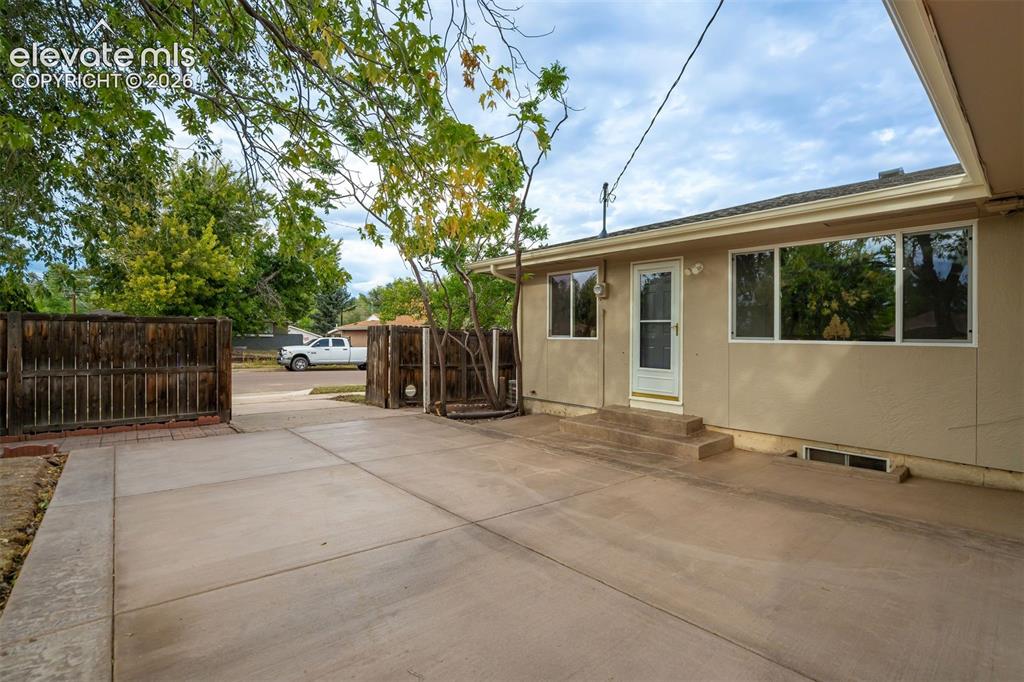 Image 47 of 50: Back driveway/garage access 