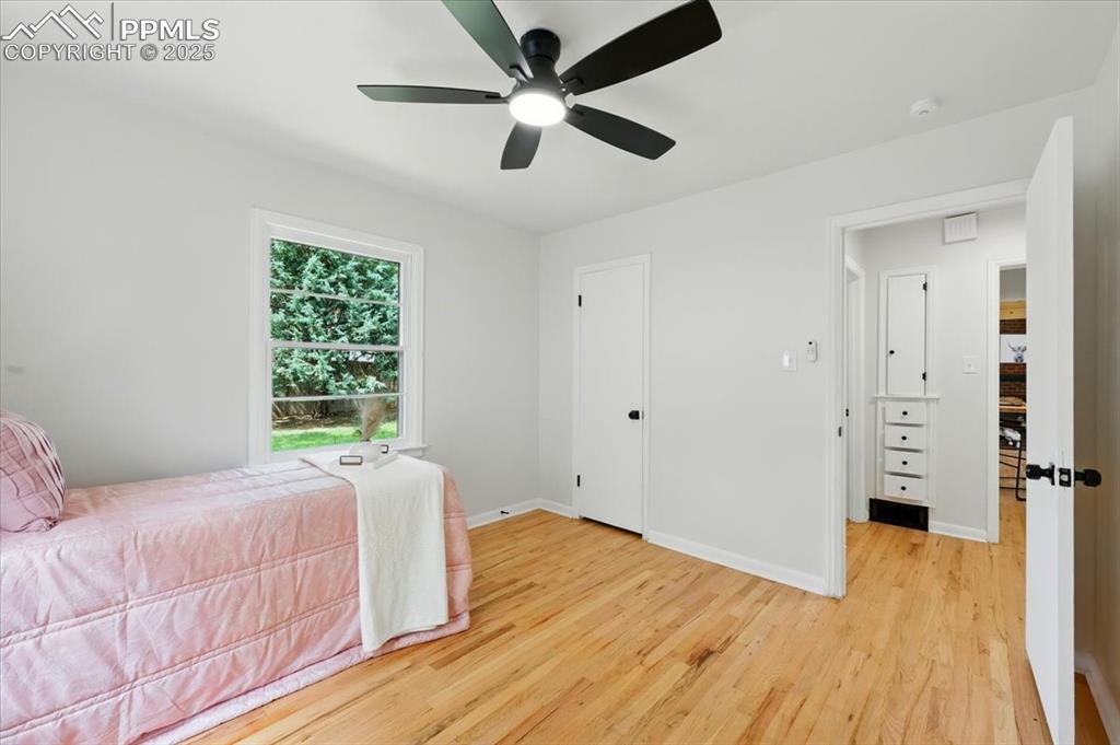 Image 17 of 32: Bedroom featuring light wood-style flooring and ceiling fan