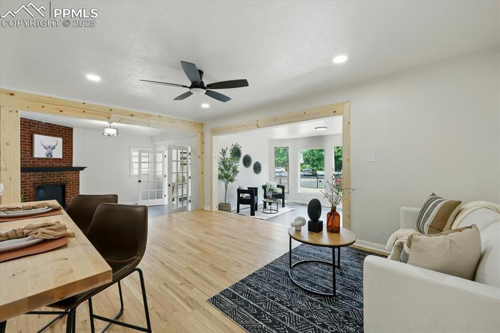 Image 19 of 32: Living area with a ceiling fan, wood finished floors, recessed lighting, a