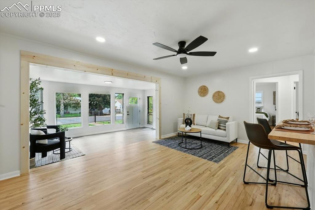 Image 6 of 32: Living room with plenty of natural light, light wood-style floors, recessed