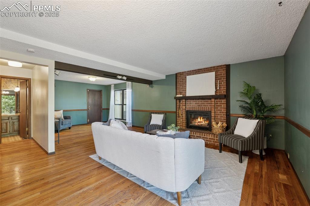 Image 17 of 49: The family room off the kitchen has a walk out to the composite deck