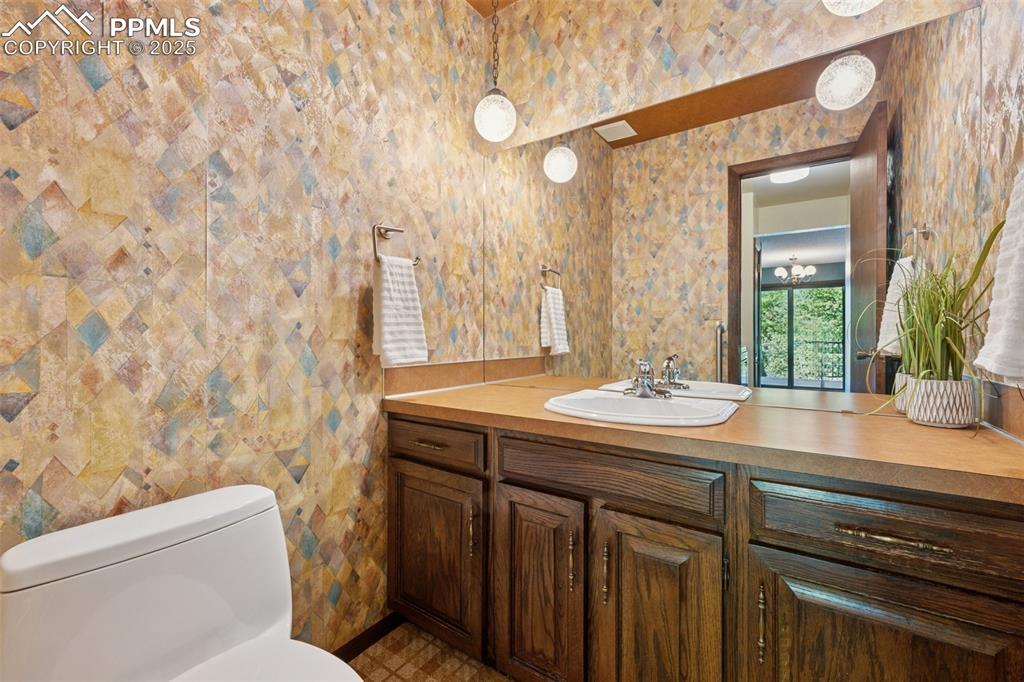 Image 22 of 49: 1/2 bath on the main