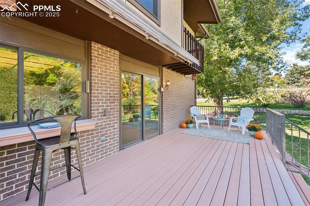 Image 23 of 49: Deck off the familyroom will become your favorite location!