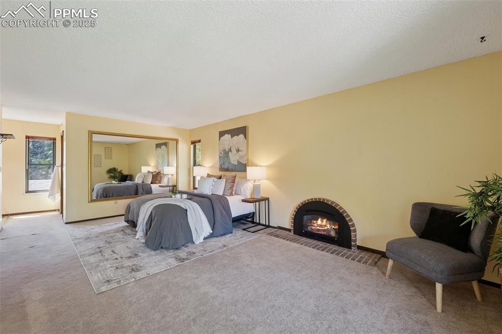 Image 27 of 49: Master suite with fireplace