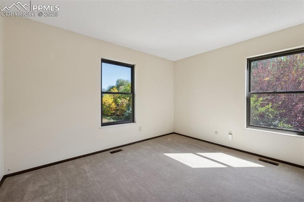 Image 30 of 49: Bedroom 3 with open space views