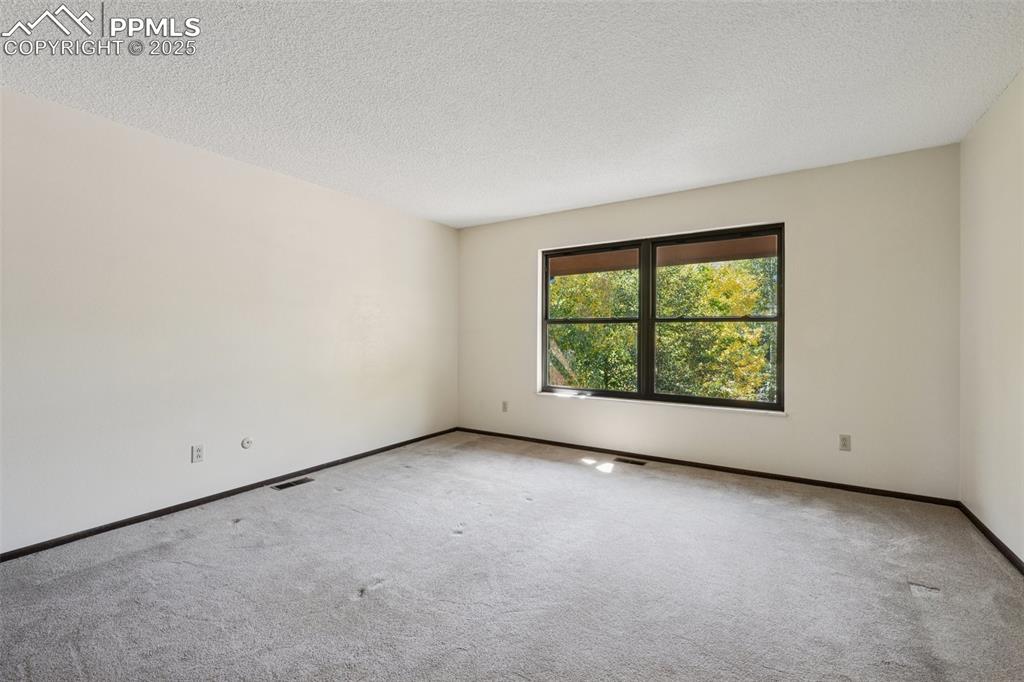 Image 31 of 49: Bedroom 4 with mountain views