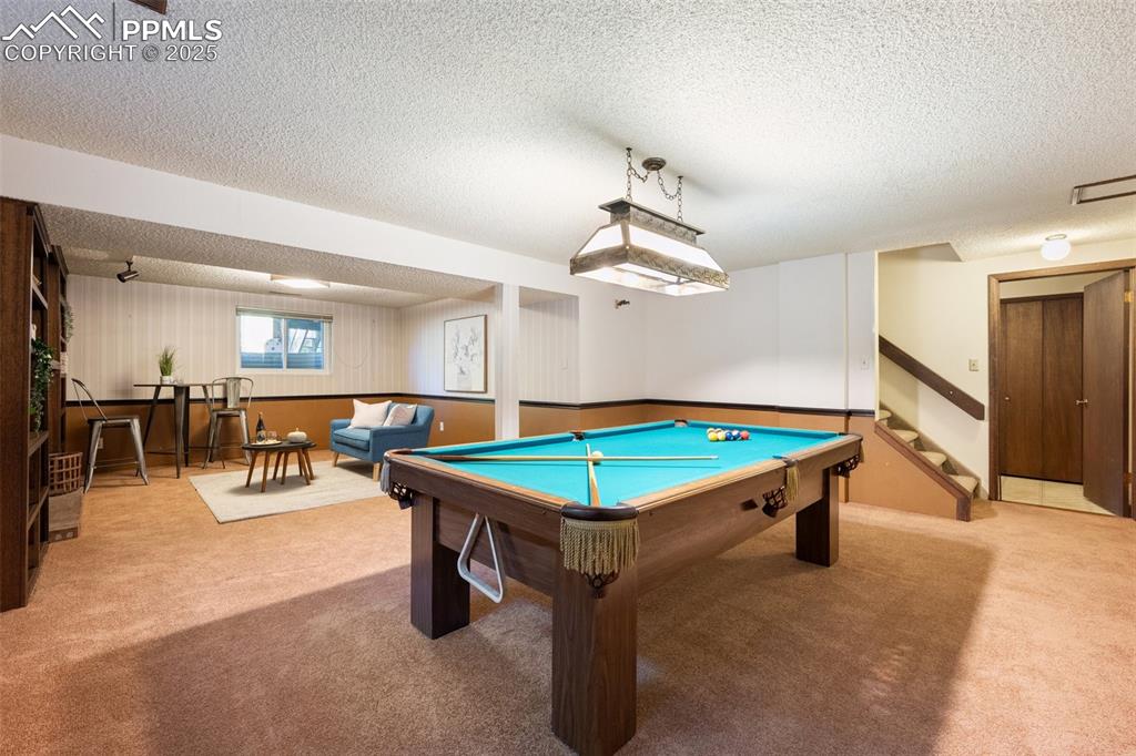 Image 33 of 49: Finished Basement with space for entertaining