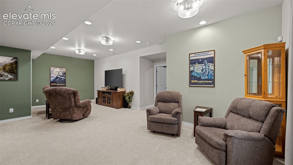 Image 16 of 45: Spacious recreation room featuring light-colored carpeting, recessed lighti