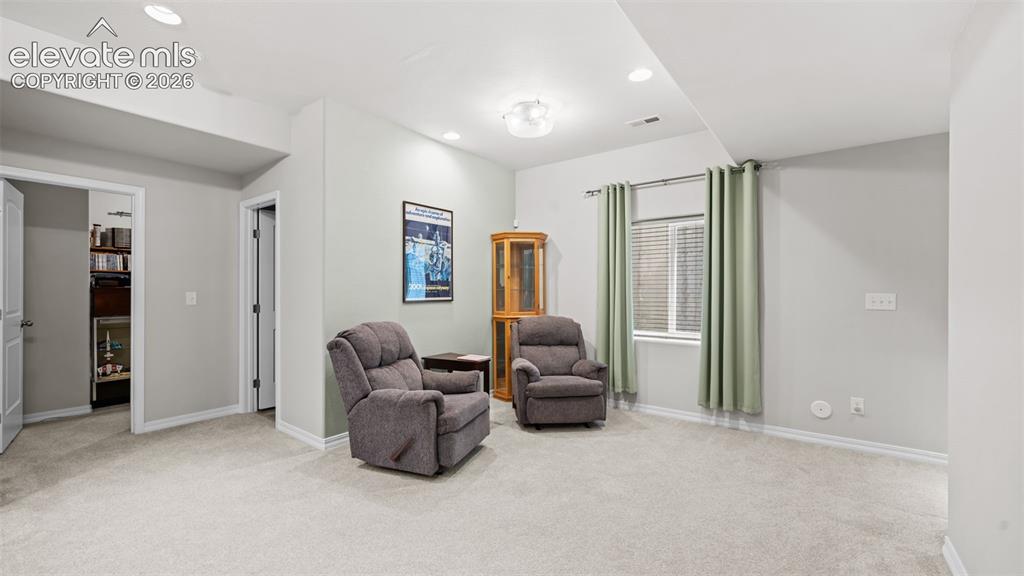 Image 20 of 45: Carpeted room featuring light gray walls, recessed lighting, a window with 