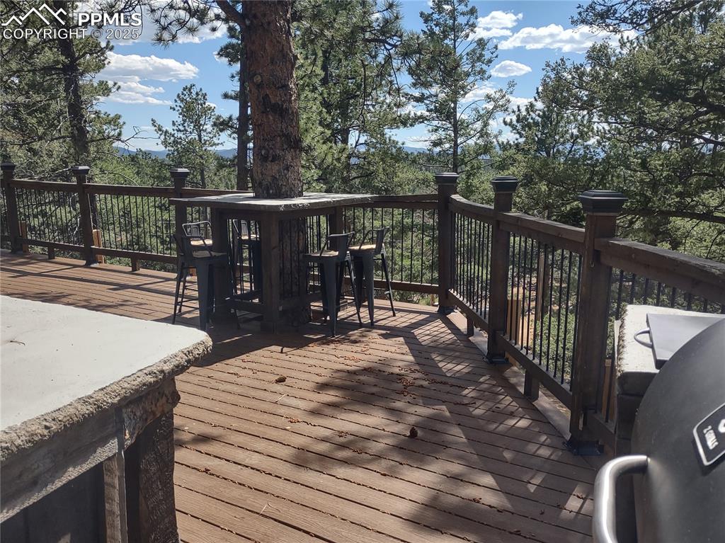 Image 18 of 50: Wrap-around tree table