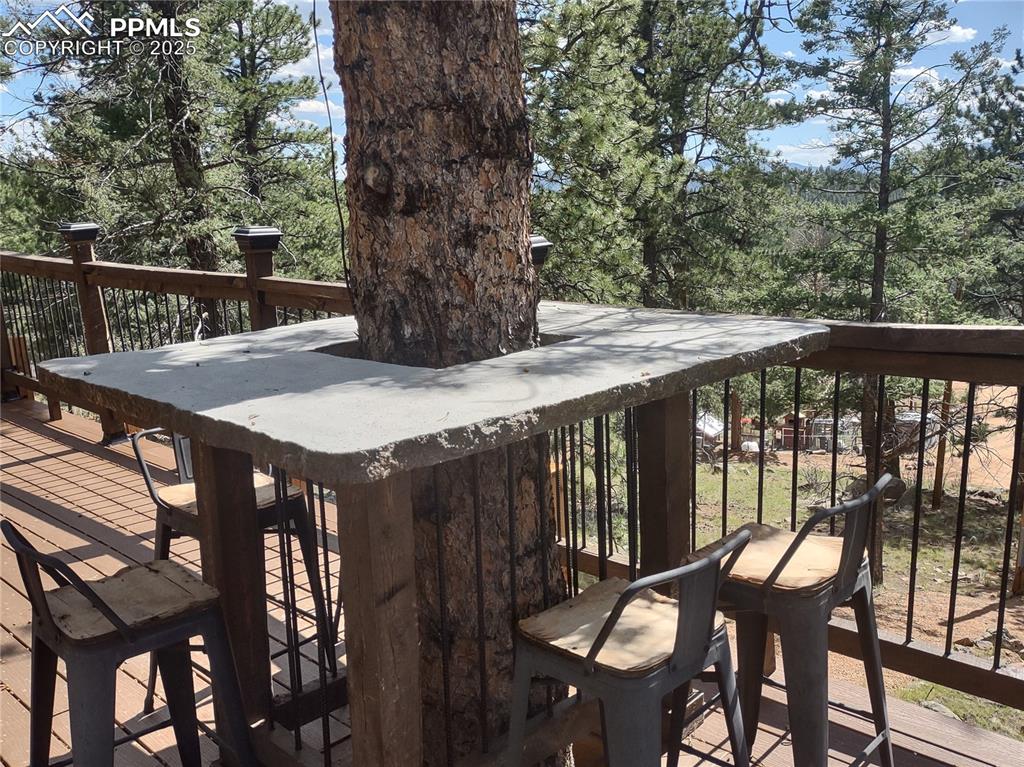 Image 23 of 50: Wrap-around tree concrete table