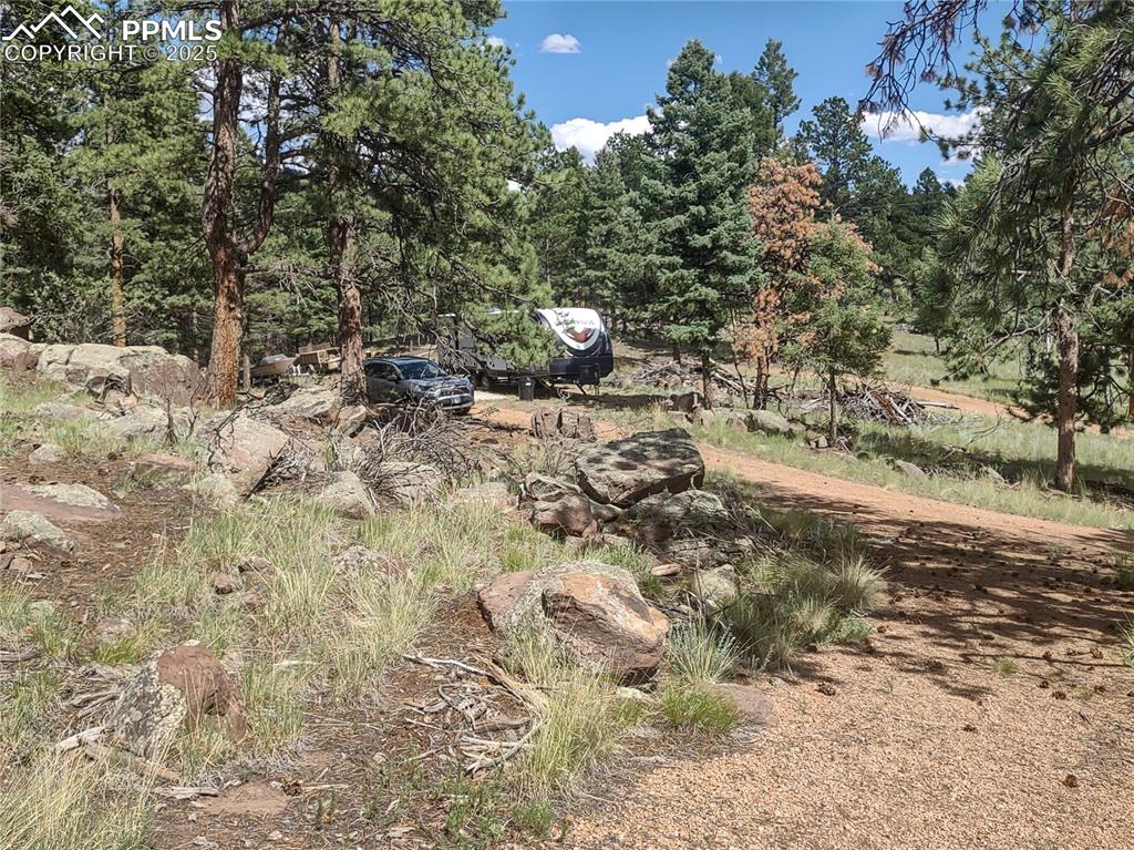 Image 27 of 50: View of RV from deck stairs