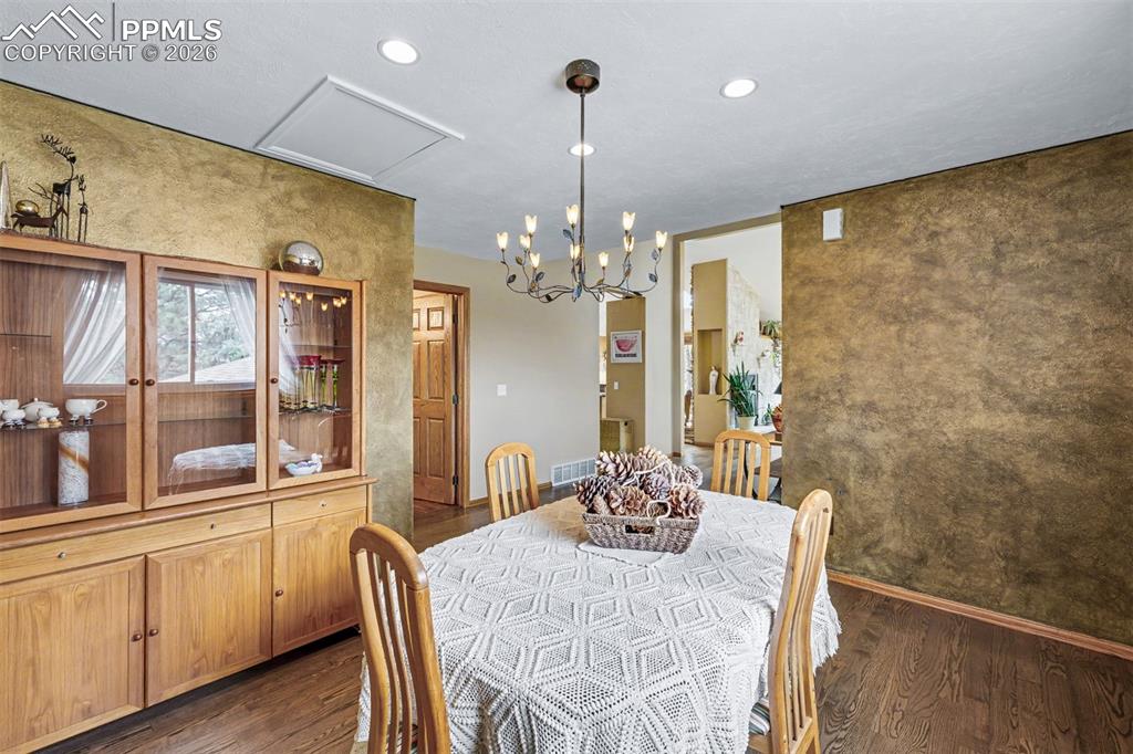 Image 16 of 44: A stainless steel pull-down faucet, undermount sink, and granite countertop