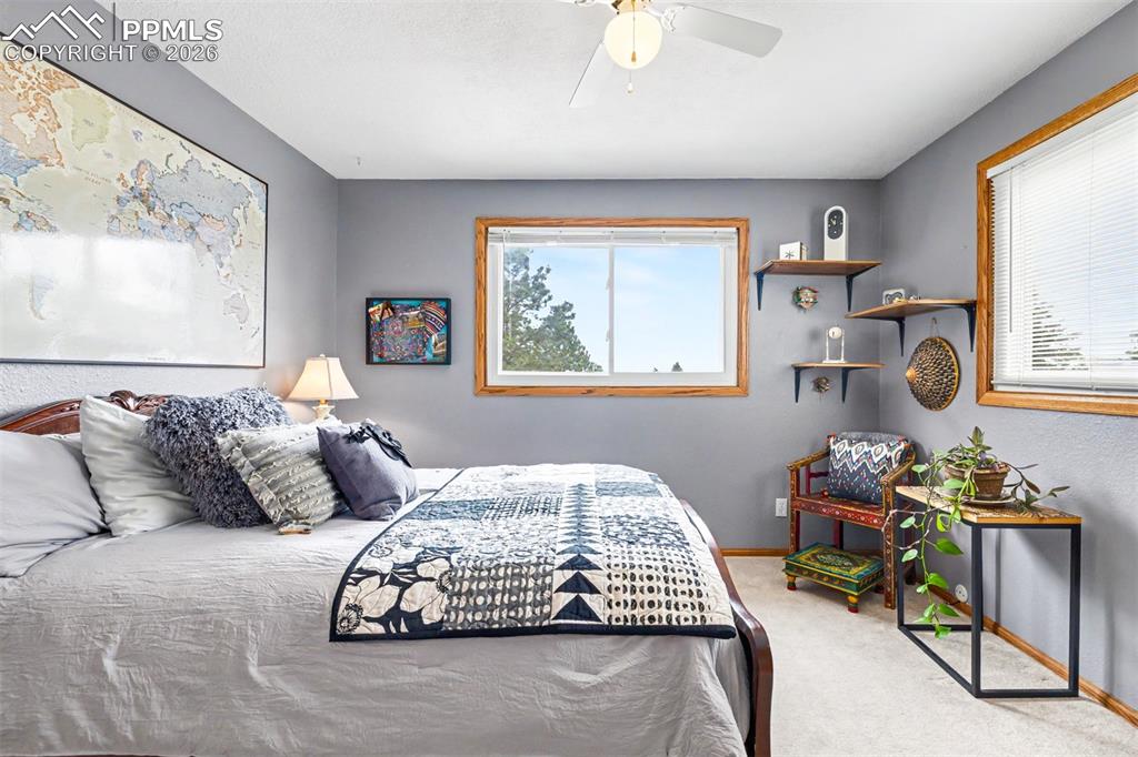 Image 21 of 44: The spacious primary bedroom features private sliding door access to its ow