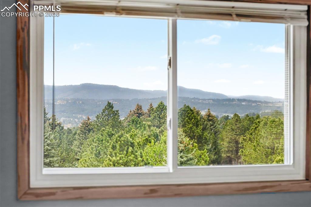 Image 22 of 44: The primary suite offers a seamless connection to a beautifully updated en-