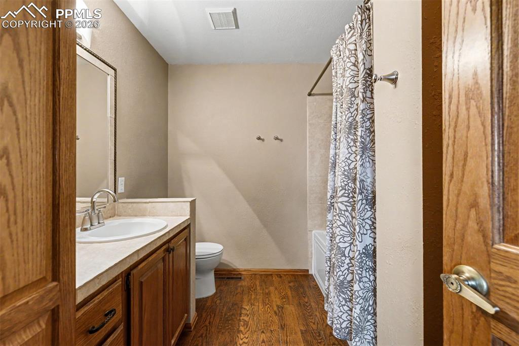 Image 23 of 44: Surrounded by a cathedral of Ponderosa pines, the private deck off the prim