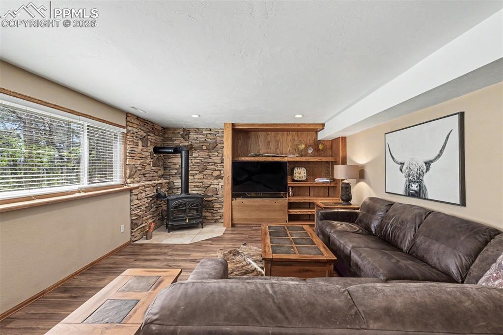 Image 25 of 44: With two large windows framing treetop and mountain views, this bright bedr