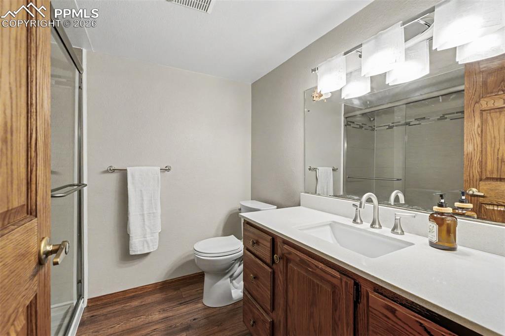 Image 31 of 44: The expansive lower level flows from a generous seating area to a game tabl