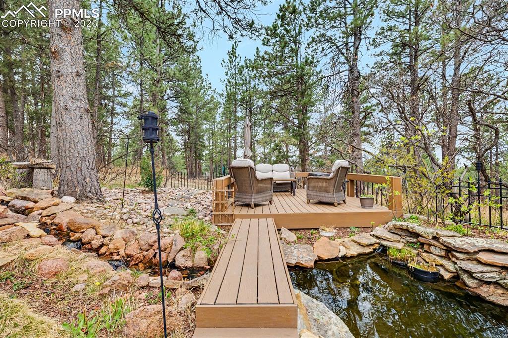 Image 35 of 44: Updated and clean, this basement bathroom features a modern white quartz va