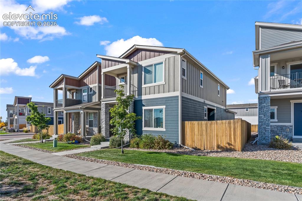Image 2 of 17: Modern two-story residence featuring board-and-batten exterior siding in so