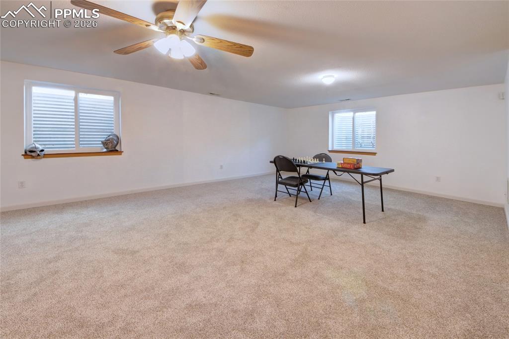 Image 19 of 36: Living room has ceiling fan