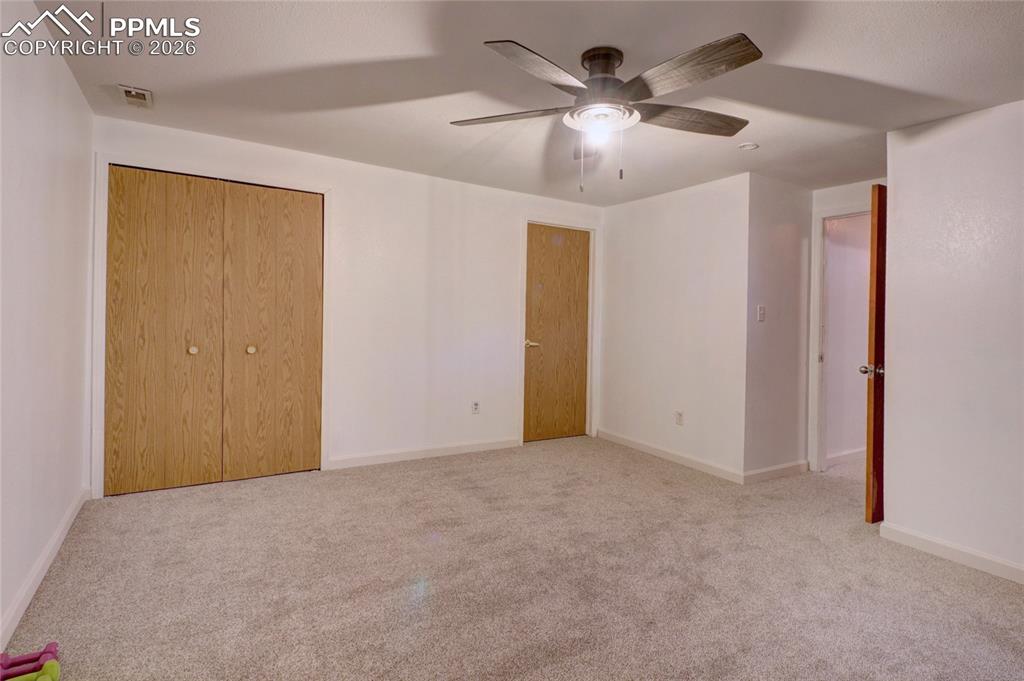 Image 23 of 36: Bedroom 3 has a ceiling fan