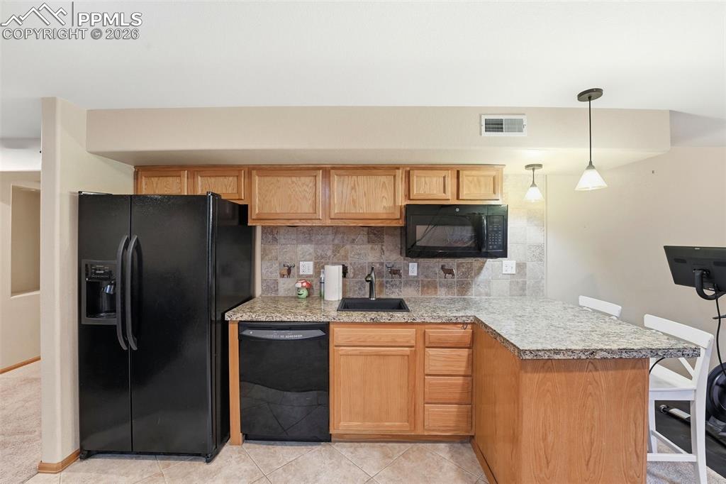 Image 41 of 50: Basement Kitchenette