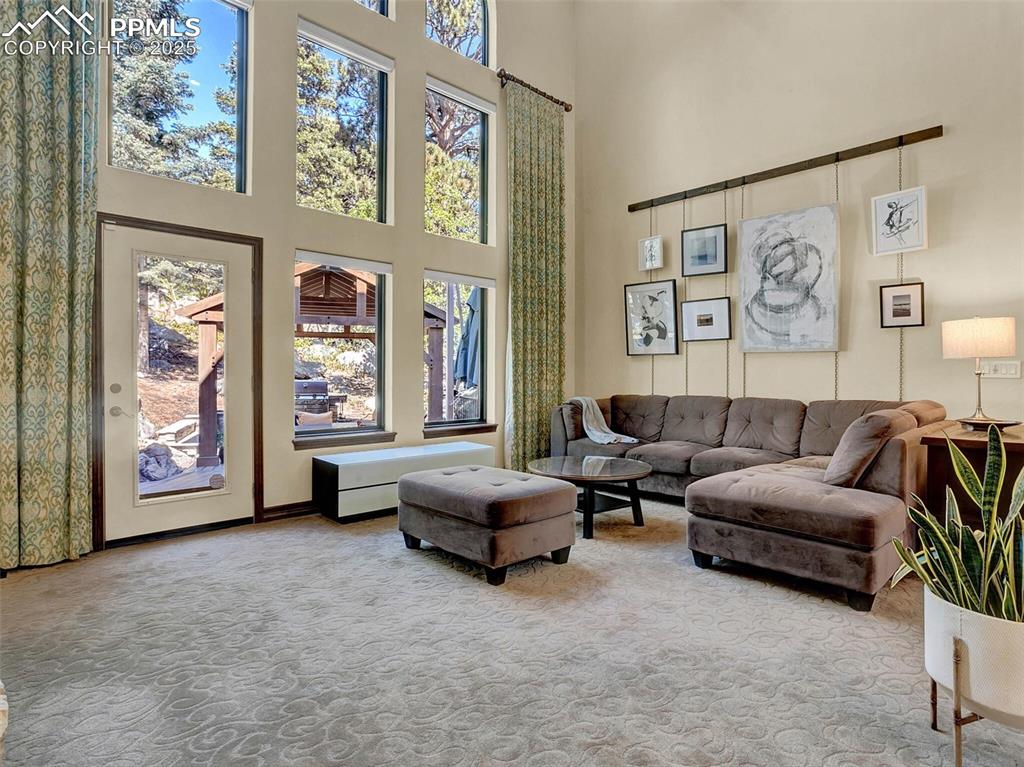 Image 13 of 37: Living room looking outside to gazebo