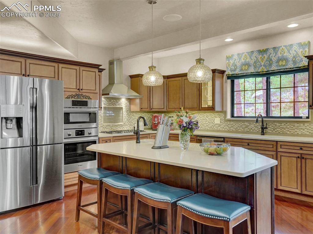 Image 19 of 37: Kitchen island with barstools