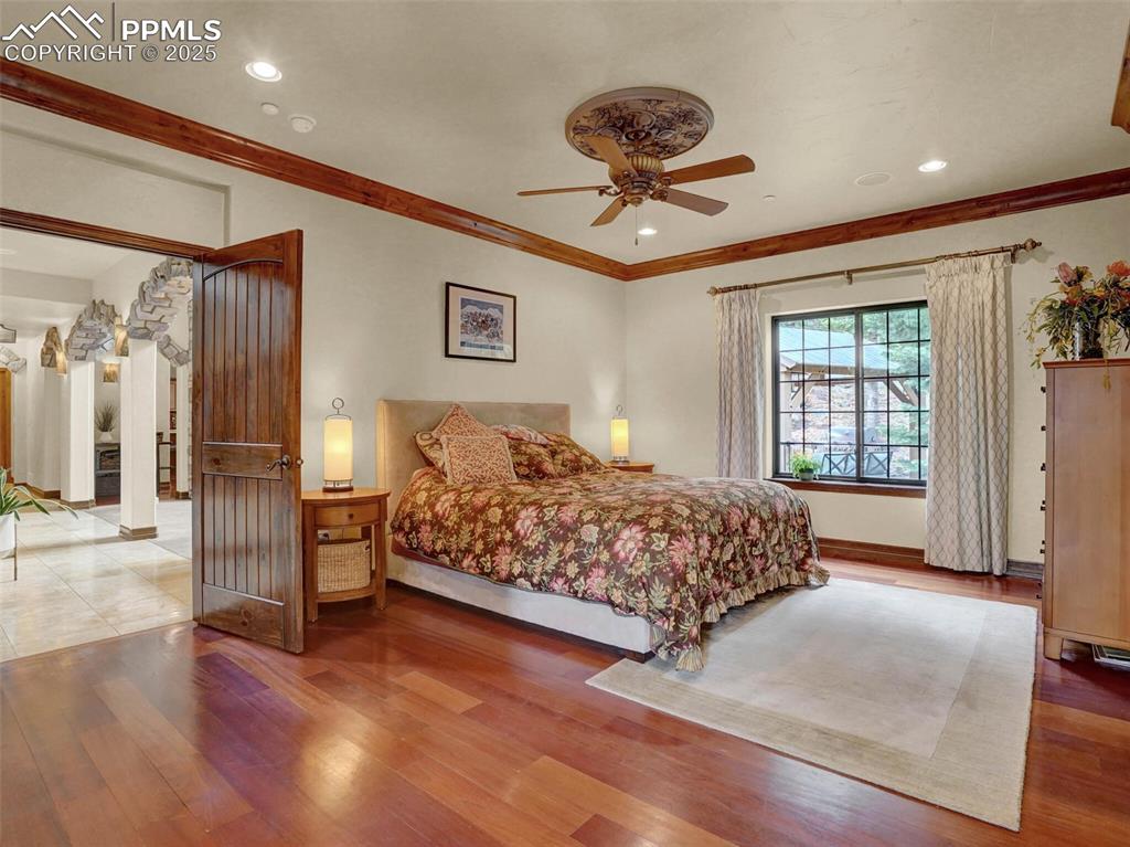 Image 27 of 37: Primary Bedroom looking out into the foyer/living room