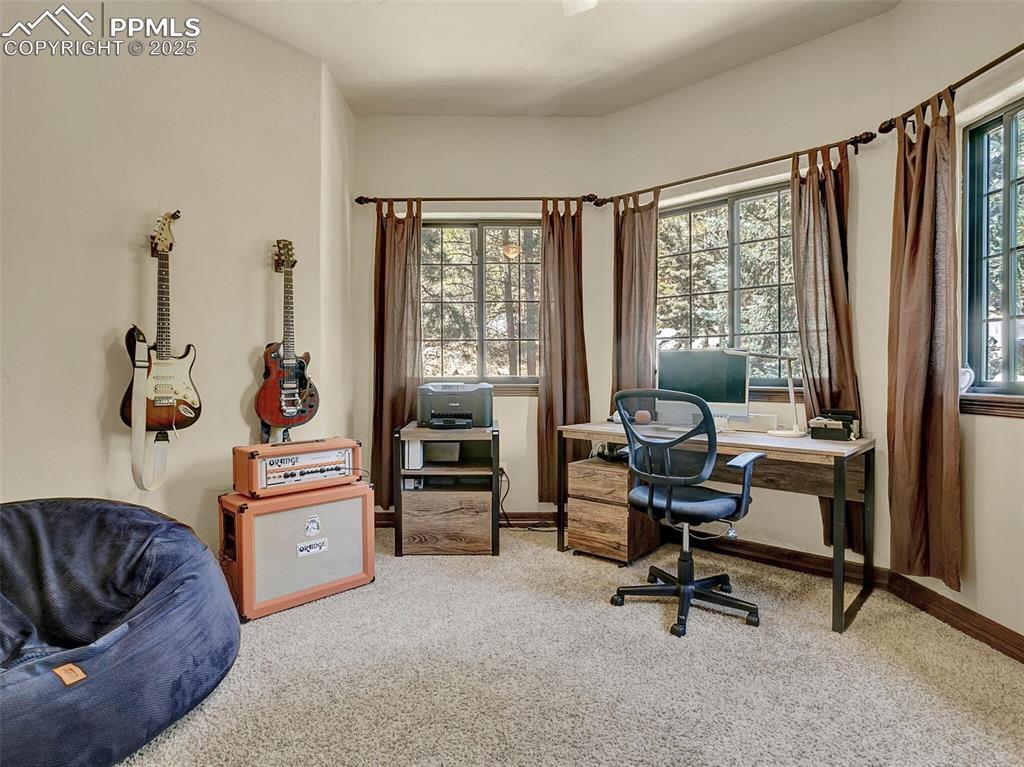 Image 33 of 37: Upper level bedroom