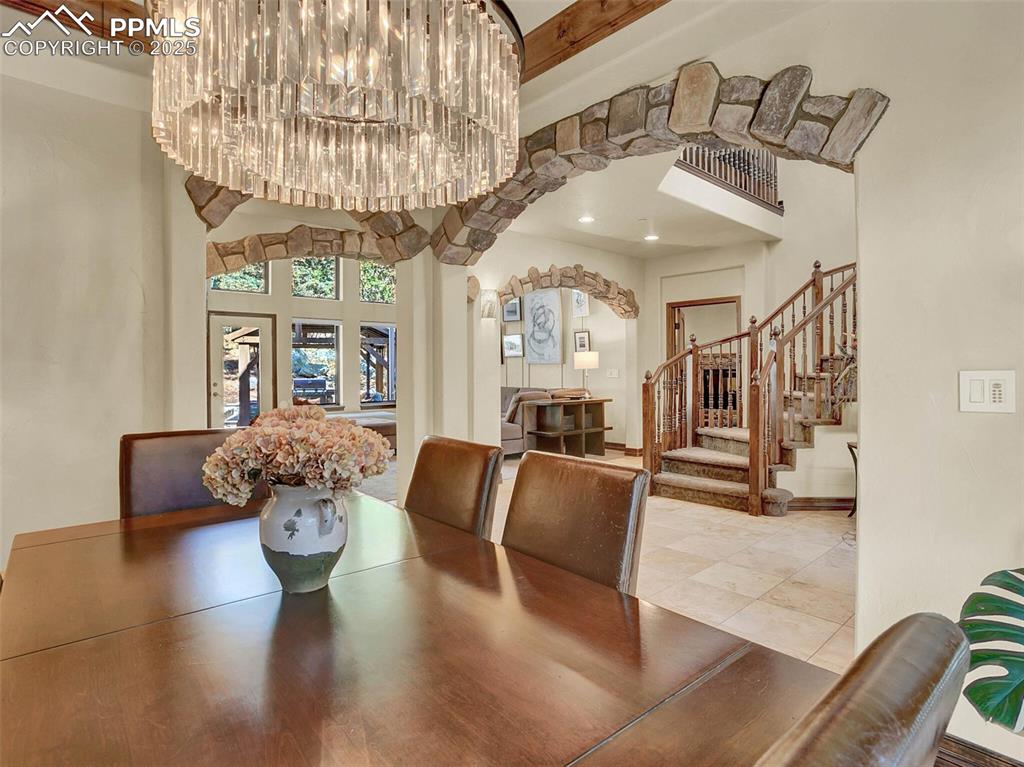 Image 9 of 37: Dining area looking into foyer area and living room