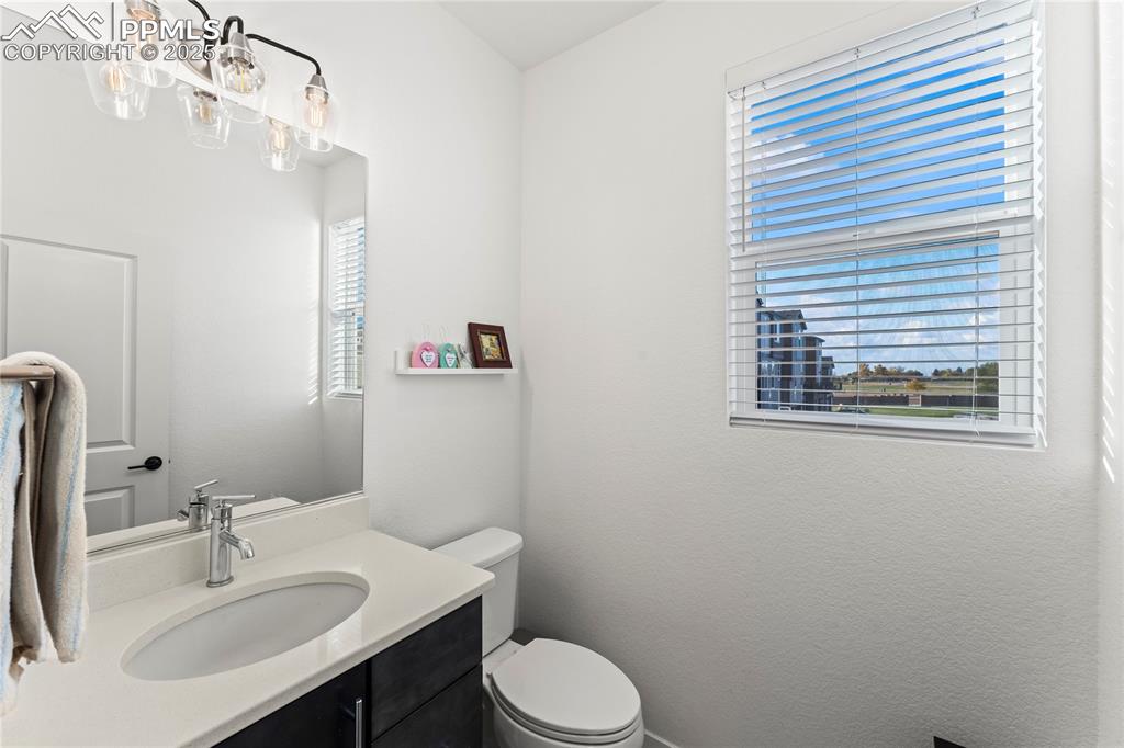 Image 17 of 31: Half bath featuring vanity and a textured wall