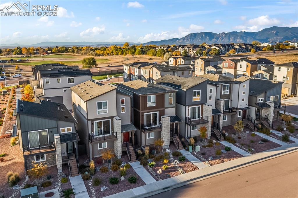 Image 2 of 31: Aerial view of residential area featuring mountains