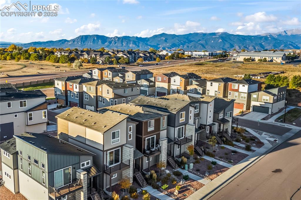 Image 3 of 31: Aerial view of residential area with mountains