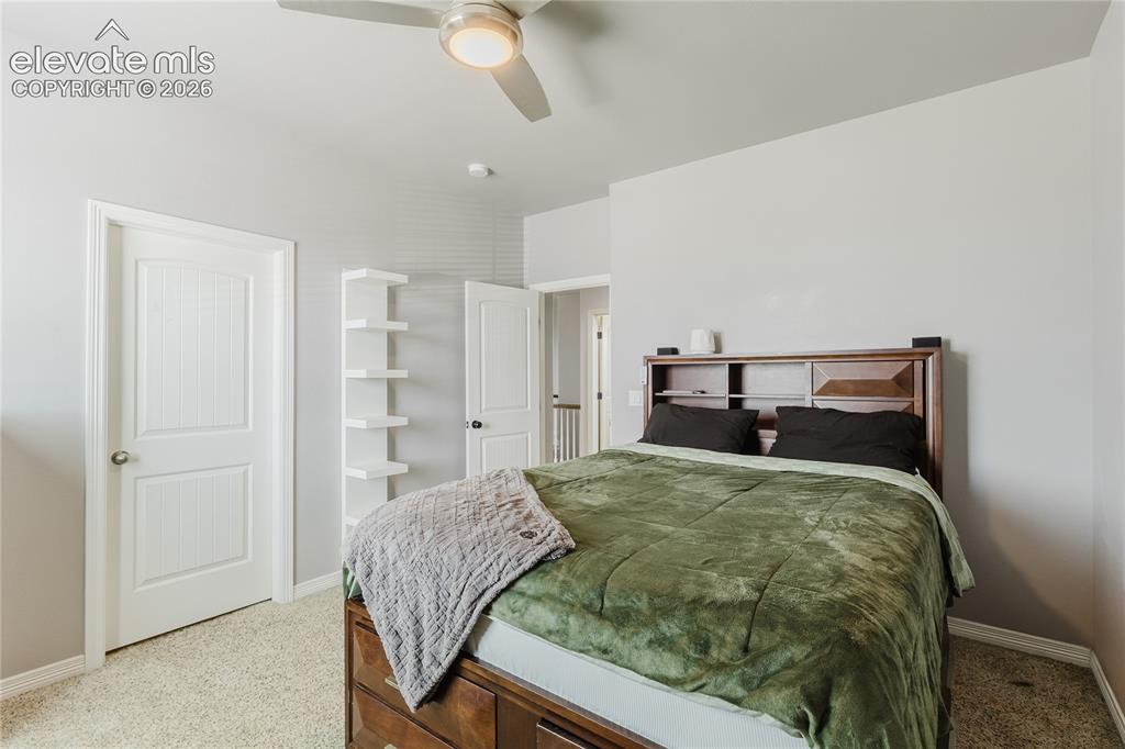 Image 22 of 46: Neutral tone wall paint with a built-in ceiling fan and light fixture