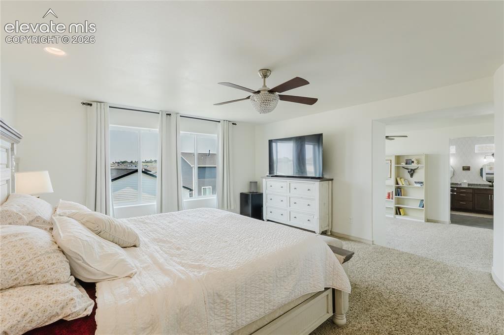 Image 30 of 46: Bright interior space featuring a ceiling fan with integrated lighting, rec