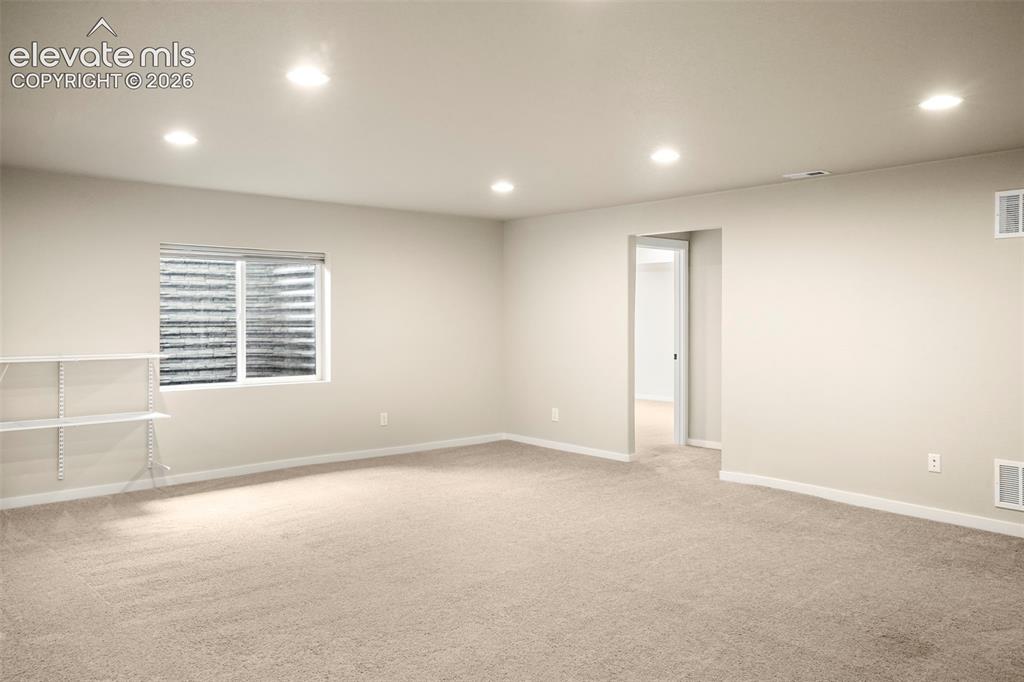 Image 21 of 37: Living room in basement