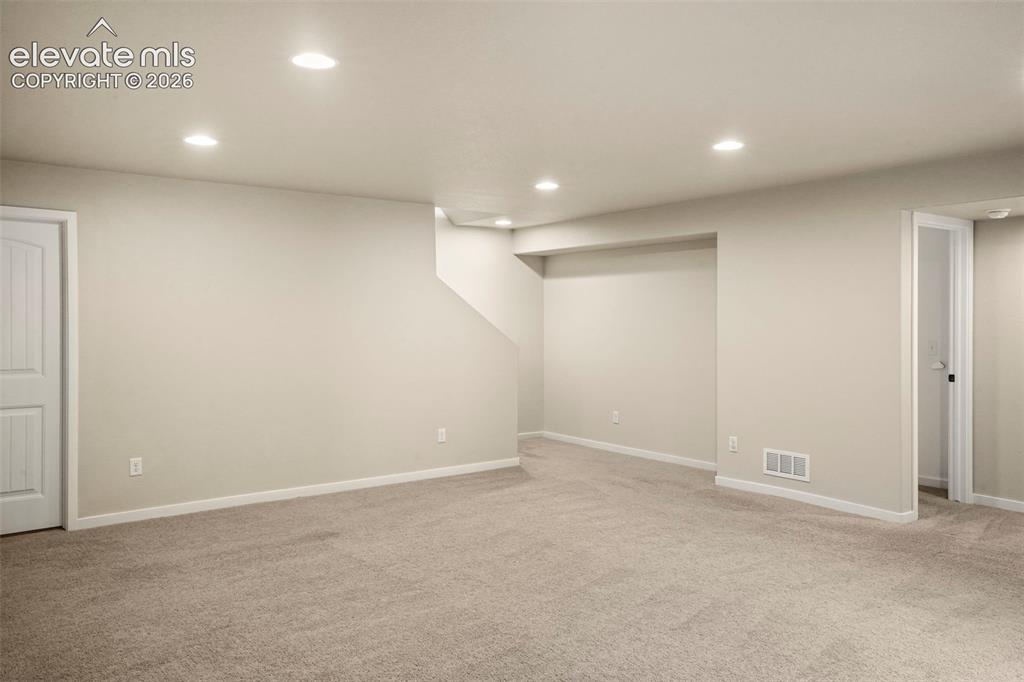 Image 22 of 37: Living room in basement.