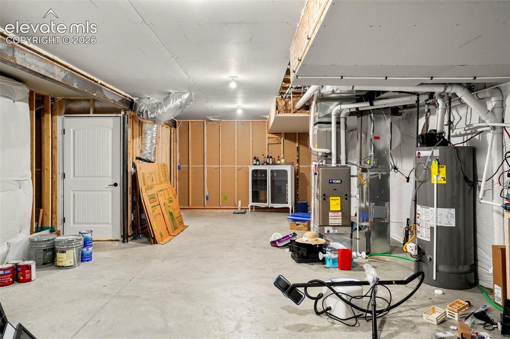 Image 27 of 37: Storage in basement along with rough-in area adjacent to secondary primary.