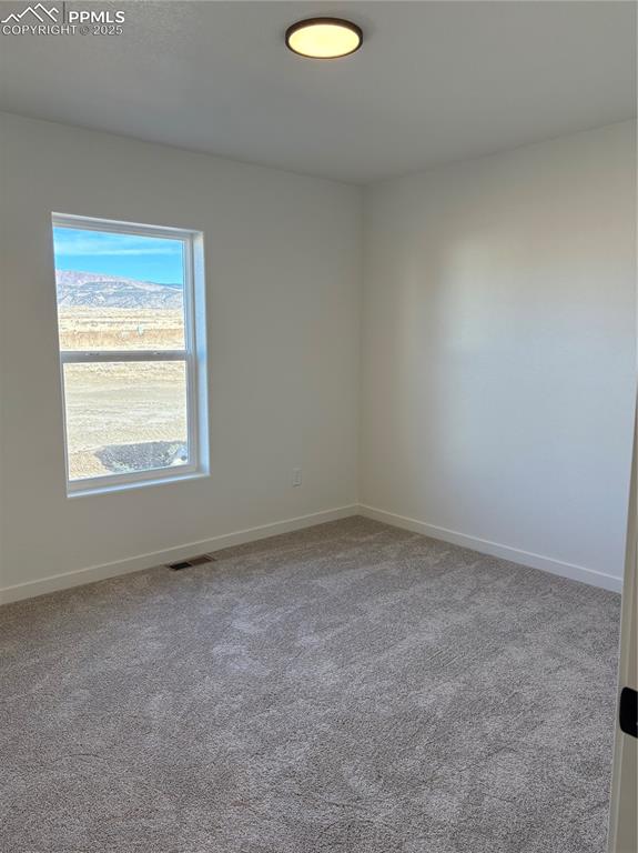 Image 14 of 22: Unfurnished room featuring light colored carpet and baseboards