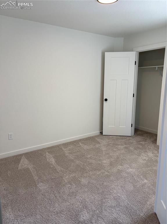 Image 2 of 22: Unfurnished bedroom featuring carpet flooring and a closet
