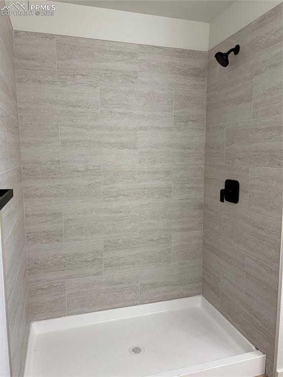 Image 21 of 22: Full bathroom with tiled shower
