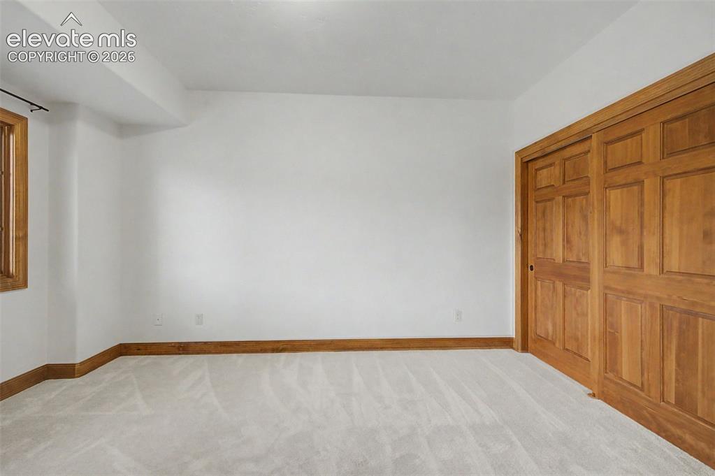 Image 37 of 42: One of two spacious garden level basement bedrooms