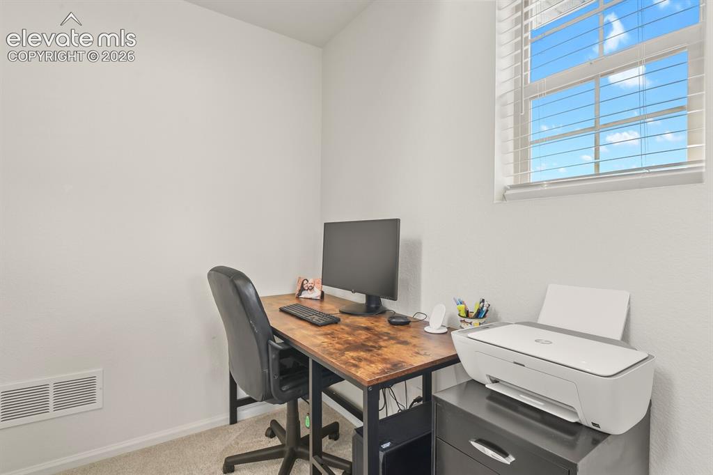 Image 23 of 31: Bright area in upper level hallway large enough for and office space