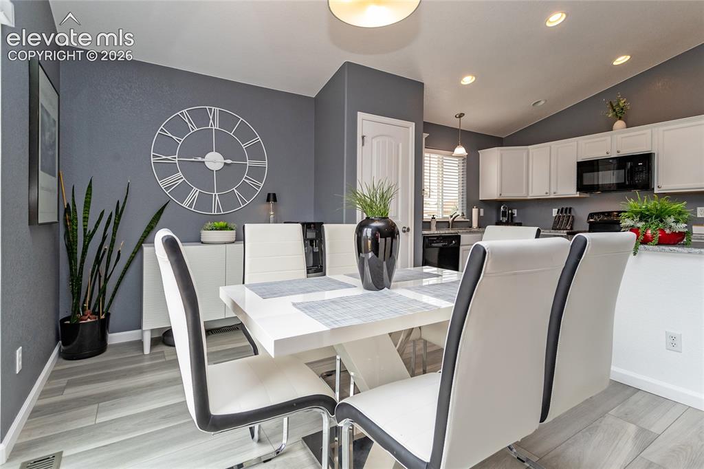 Image 14 of 49: Dining area adjoins the kitchen.